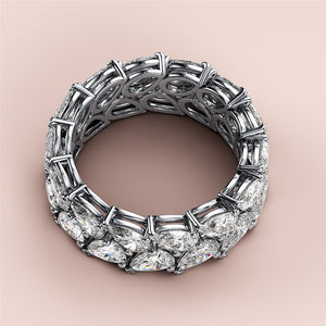 Luxury pear-shaped diamond eternity band in 14K/18K gold or platinum, elegantly displayed against a neutral background. 