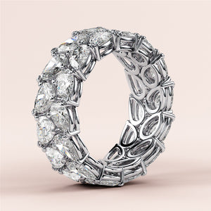 Luxury pear-shaped diamond eternity ring in 14K or 18K white gold, featured in a close-up shot for wedding band selection. 