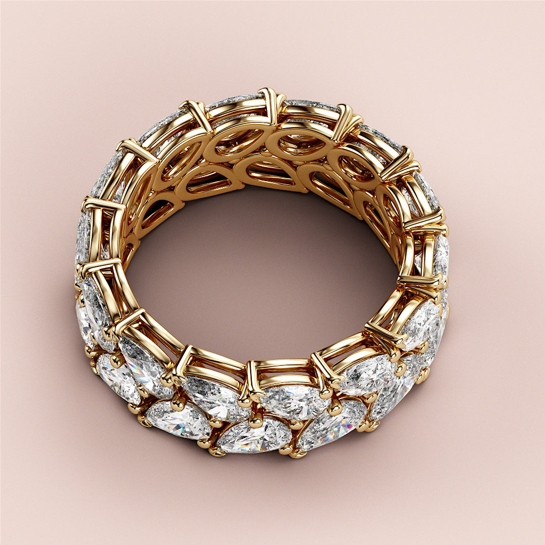 Luxurious 14K or 18K gold pear-shaped diamond eternity wedding band with double row of brilliant diamonds, showcasing fine craftsmanship. |
 
 
 #14KRecycledYellowGold
 #18KRecycledYellowGold