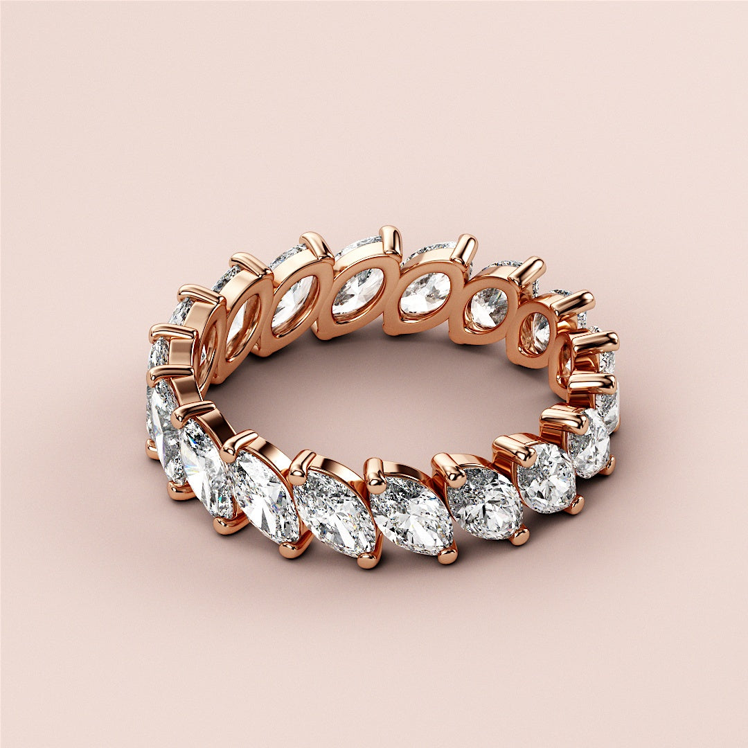 Elegant marquise-cut diamond eternity wedding band in 14K or 18K rose gold. Not worn on a model, perfect for timeless elegance. |
 
 
 
 
 #14KRecycledRoseGold
 #18KRecycledRoseGold