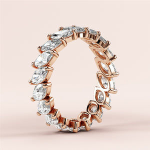 Elegant eternity band featuring marquise diamonds in 14K rose gold, perfect for weddings.  Not worn on a model. 