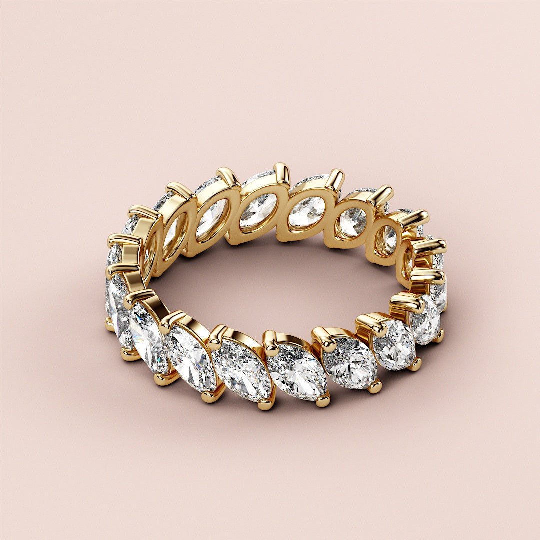 Elegant 14K yellow gold eternity wedding band featuring marquise-shaped diamonds, perfect for special occasions and timeless style. |
 
 
 #14KRecycledYellowGold
 #18KRecycledYellowGold
