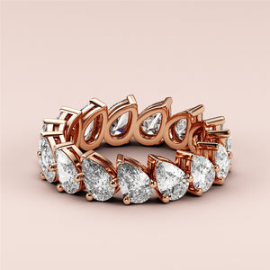 Exquisite 14K or 18K rose gold eternity wedding band featuring pear-shaped diamonds, crafted for elegance and sparkle. 