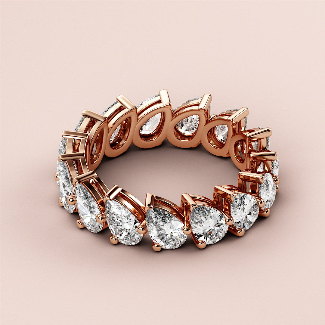 Elegant 14K Rose Gold eternity wedding band with dazzling pear-shaped diamonds, showcasing luxury and brilliance. |
 
 
 
 
 #14KRecycledRoseGold
 #18KRecycledRoseGold