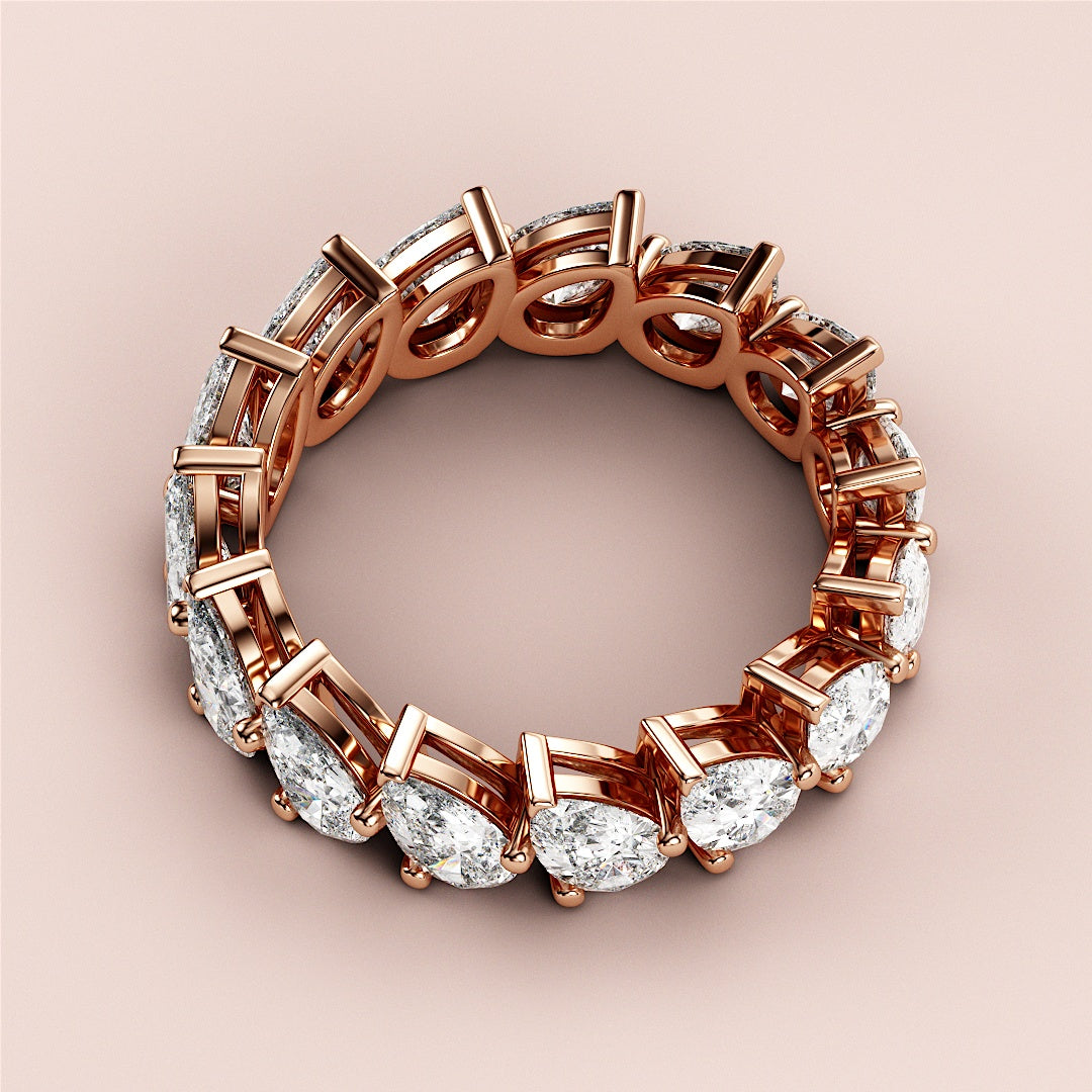 Elegant pear-shaped diamond eternity ring in 14K rose gold, a stunning wedding band showcasing a continuous loop of diamonds. |
 
 
 
 
 #14KRecycledRoseGold
 #18KRecycledRoseGold