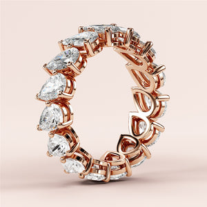 Stunning 14K/18K gold or platinum teardrop diamond eternity wedding band, showcasing exquisite craftsmanship in a continuous loop. 