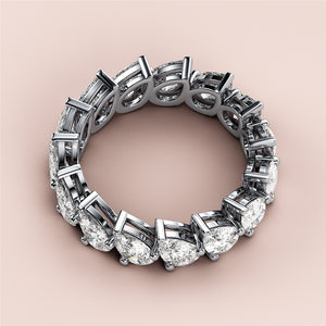 Stunning pear-shaped diamond eternity wedding band in 14K or 18K gold or platinum setting, elegantly displayed on soft background. 