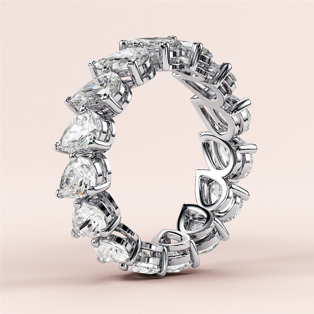 Elegant 14K or 18K gold wedding band featuring pear-shaped diamonds in a stunning eternity design, perfect for sophisticated styles. |
 #14KRecycledWhiteGold
 #18KRecycledWhiteGold
 
 
 
 
 #Platinum