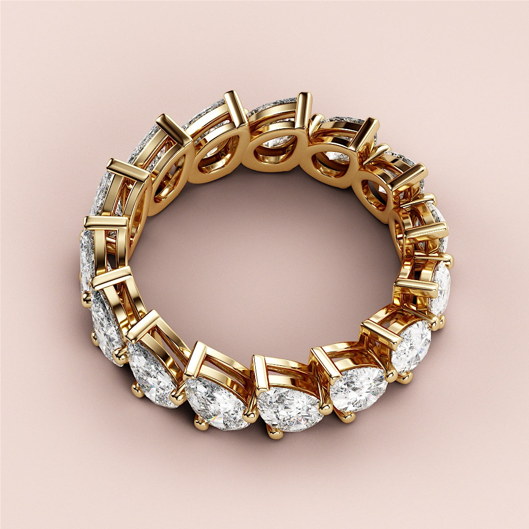 Elegant 14K or 18K gold wedding band featuring pear-shaped diamonds in a continuous eternity design, perfect for timeless elegance. |
 
 
 #14KRecycledYellowGold
 #18KRecycledYellowGold