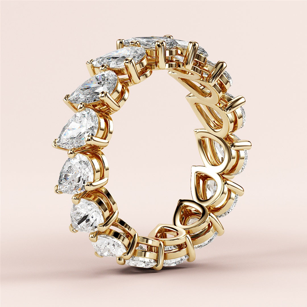 Exquisite 14K gold pear-shaped diamond eternity ring, perfect for weddings or special occasions, adorned with stunning diamonds. |
 
 
 #14KRecycledYellowGold
 #18KRecycledYellowGold
