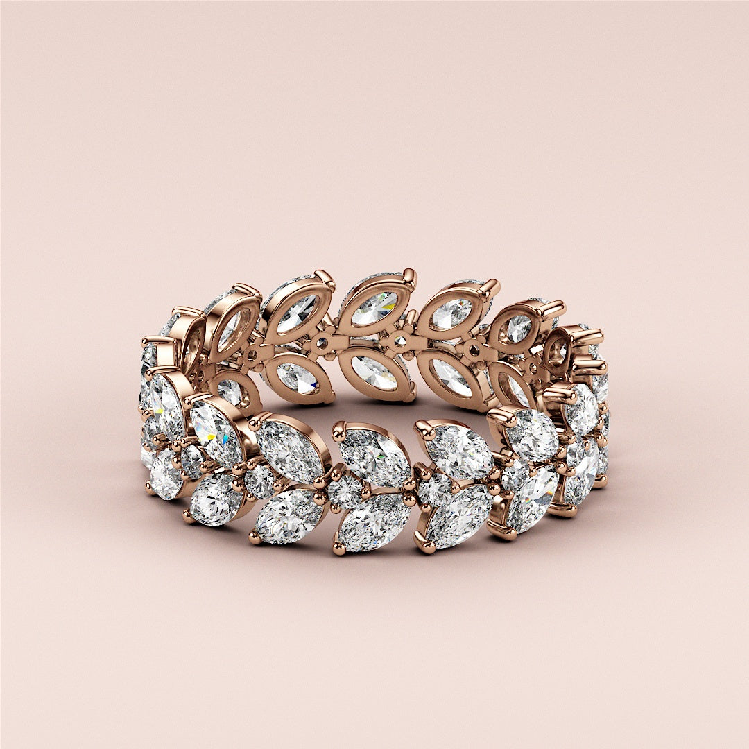 Elegant 14K or 18K rose gold eternity band with marquise-shaped diamonds in a leaf pattern, showcasing exquisite craftsmanship. |
 
 
 
 
 #14KRecycledRoseGold
 #18KRecycledRoseGold