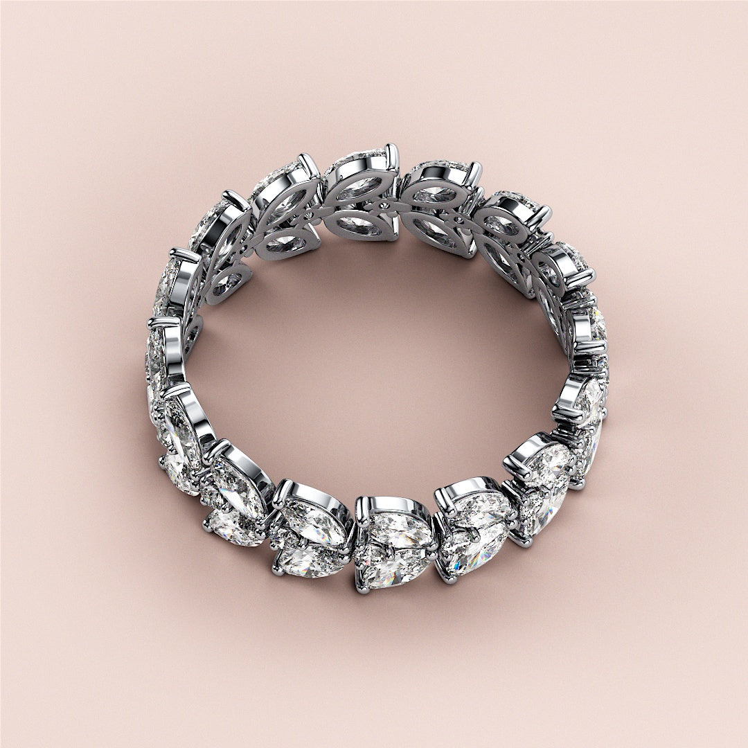 Elegant wedding band featuring marquise and pear-shaped diamonds in 14K or 18K gold or platinum with intricate leaf designs. |
 #14KRecycledWhiteGold
 #18KRecycledWhiteGold
 
 
 
 
 #Platinum