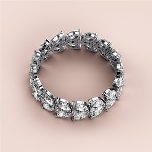 Elegant wedding band featuring marquise and pear-shaped diamonds in 14K or 18K gold or platinum with intricate leaf designs. 