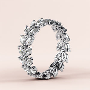 Elegant 14K and 18K white gold marquise eternity wedding band featuring sparkling diamonds and intricate detailing. 