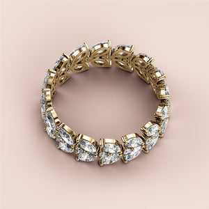 Elegant 14K/18K gold marquise and round diamond eternity band, perfect for weddings or special occasions.  Jewelry not worn on model. 