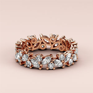 Elegant 14K rose gold eternity wedding band featuring marquise-cut diamonds, not worn on a model.  Perfect for timeless love. 