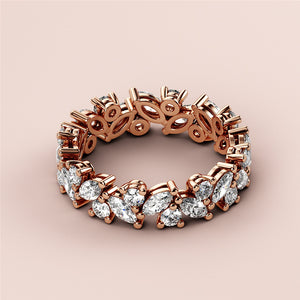 Elegant rose gold eternity wedding band featuring marquise-cut diamonds, available in 14K or 18K gold and platinum. 