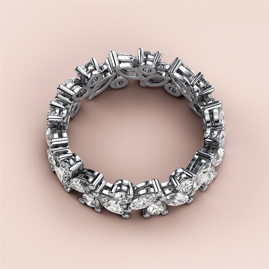 Elegant 14K/18K white gold eternity wedding band with marquise and pear-shaped diamonds, detailed view on creamy background. |
 #14KRecycledWhiteGold
 #18KRecycledWhiteGold
 
 
 
 
 #Platinum