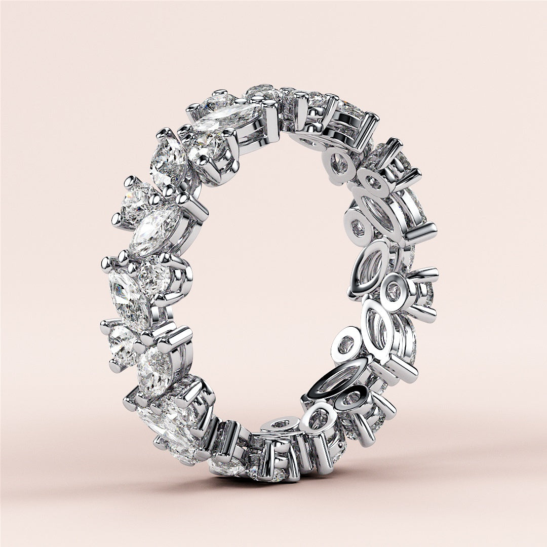 14K/18K/Platinum eternity band with marquise-cut and round diamonds, elegantly displayed on a neutral background. |
 #14KRecycledWhiteGold
 #18KRecycledWhiteGold
 
 
 
 
 #Platinum