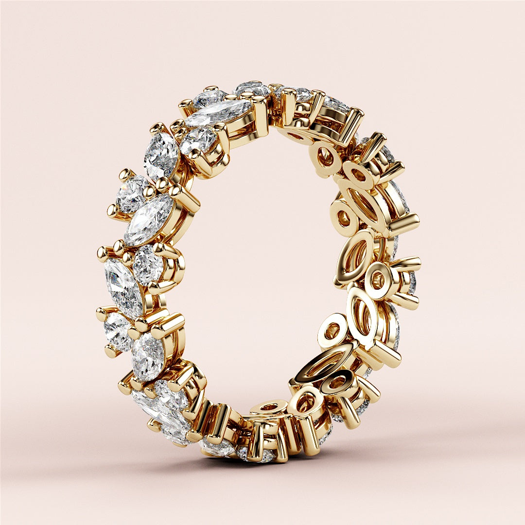Intricate yellow gold eternity ring featuring marquise and pear diamonds; available in 14K, 18K, or platinum wedding band options. |
 
 
 #14KRecycledYellowGold
 #18KRecycledYellowGold