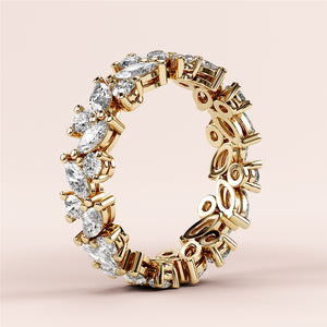 Intricate yellow gold eternity ring featuring marquise and pear diamonds; available in 14K, 18K, or platinum wedding band options. 