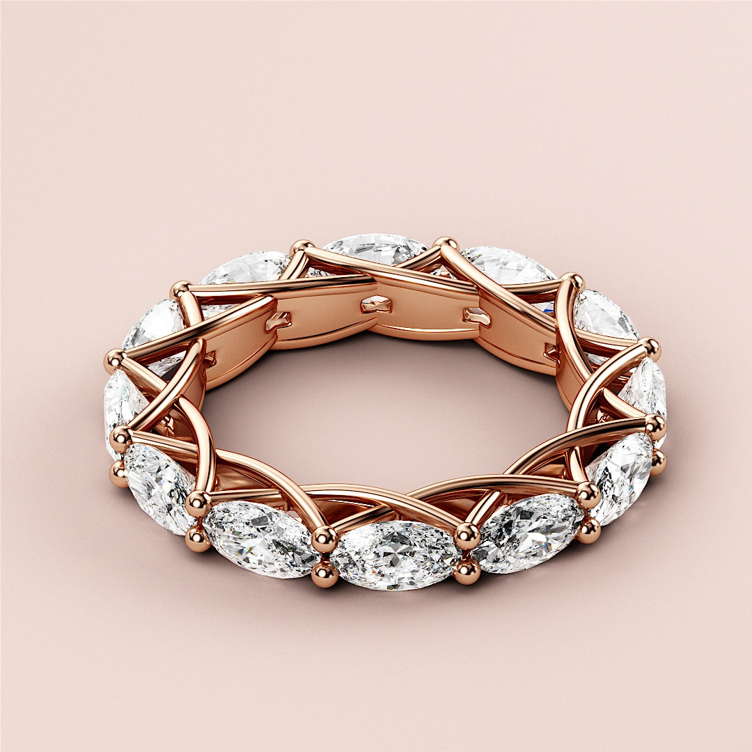 Elegant 14K Rose Gold wedding band featuring marquise-cut diamonds in a trellis design, showcasing unique craftsmanship. 