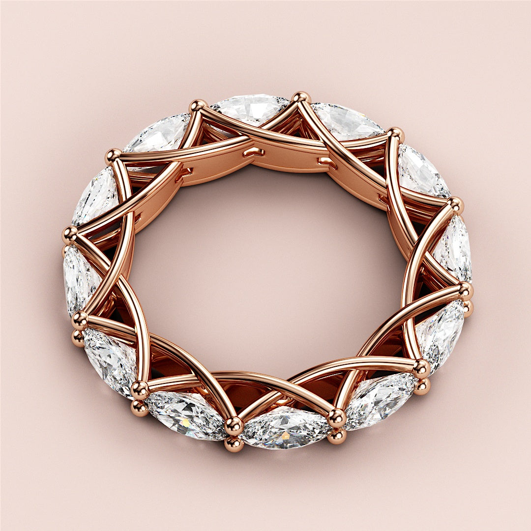 Elegant rose gold eternity wedding band featuring marquise-cut diamonds, available in 14K, 18K gold, or platinum. 
