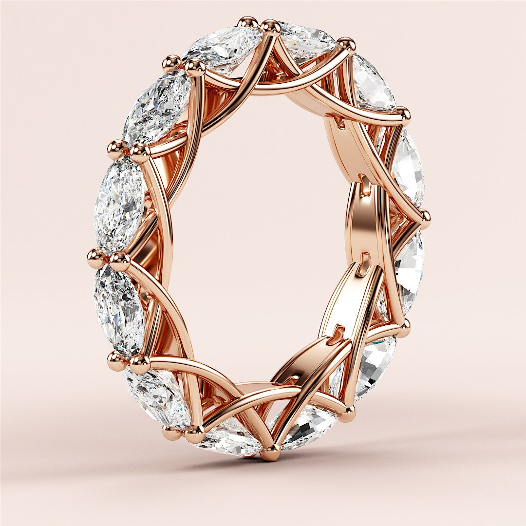 Elegant marquise diamond eternity wedding band in 14K or 18K rose gold, featuring a stunning line of diamonds in a sophisticated setting. 