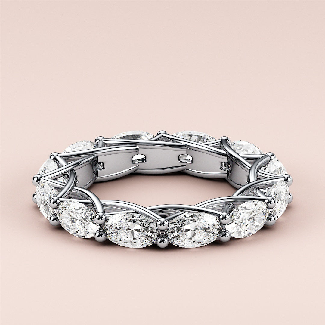 Elegant white gold wedding band featuring an oval eternity trellis design, available in 14K or 18K gold or platinum. 