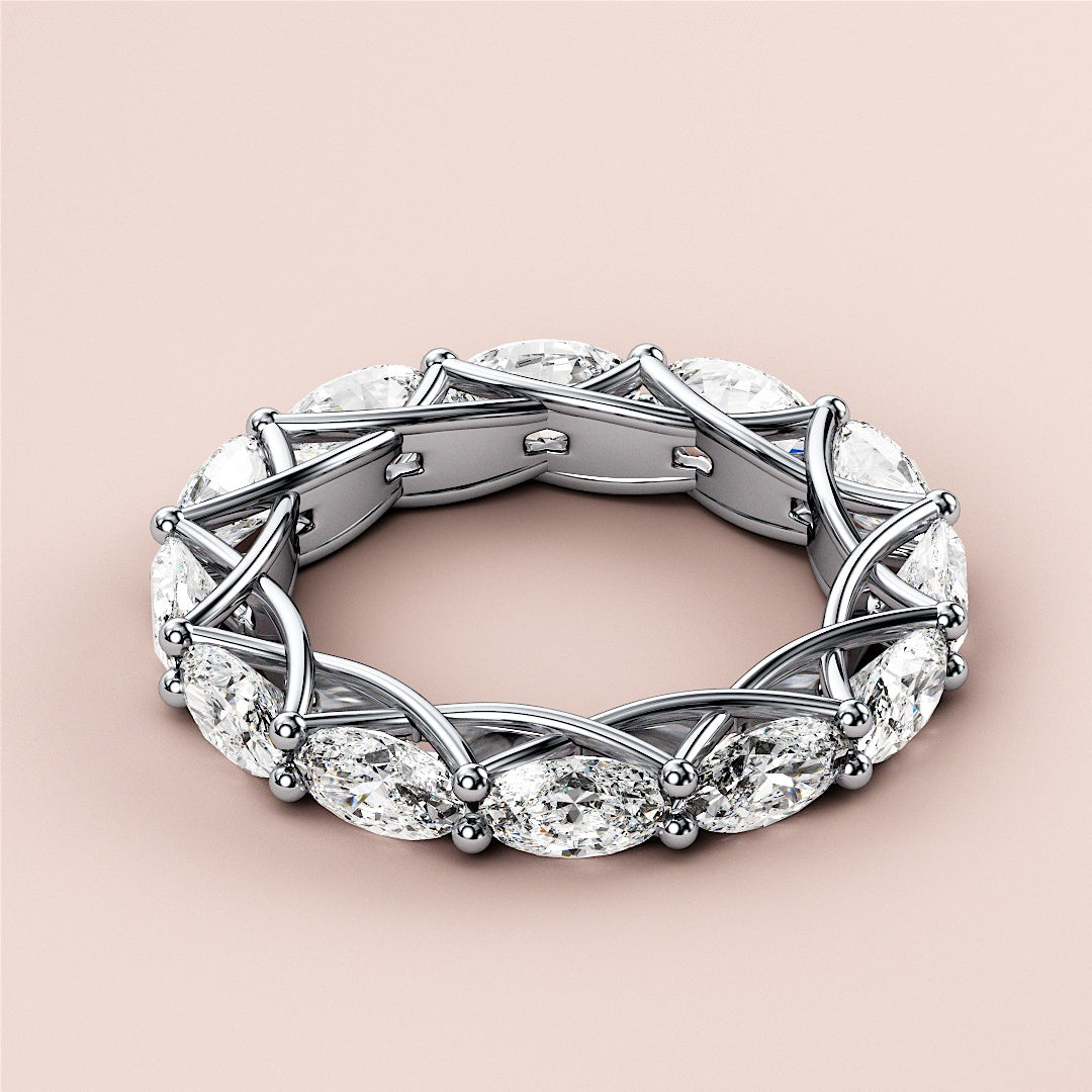 Elegant 14K/18K white gold eternity wedding band with marquise-cut diamonds in a lattice setting, perfect for timeless love. 