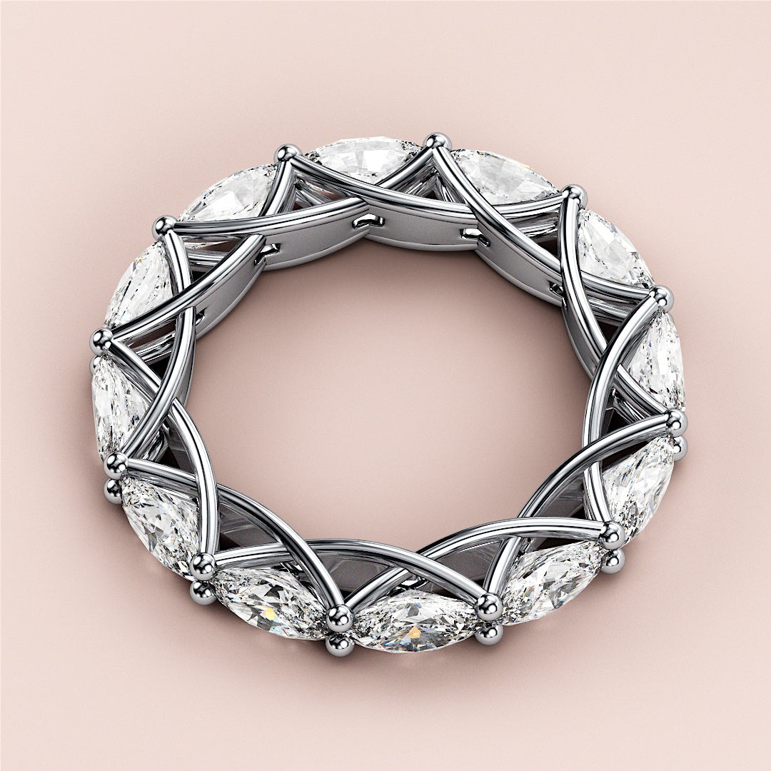 Elegant 14K or 18K white gold eternity band featuring marquise-cut diamonds in a unique criss-cross design. 