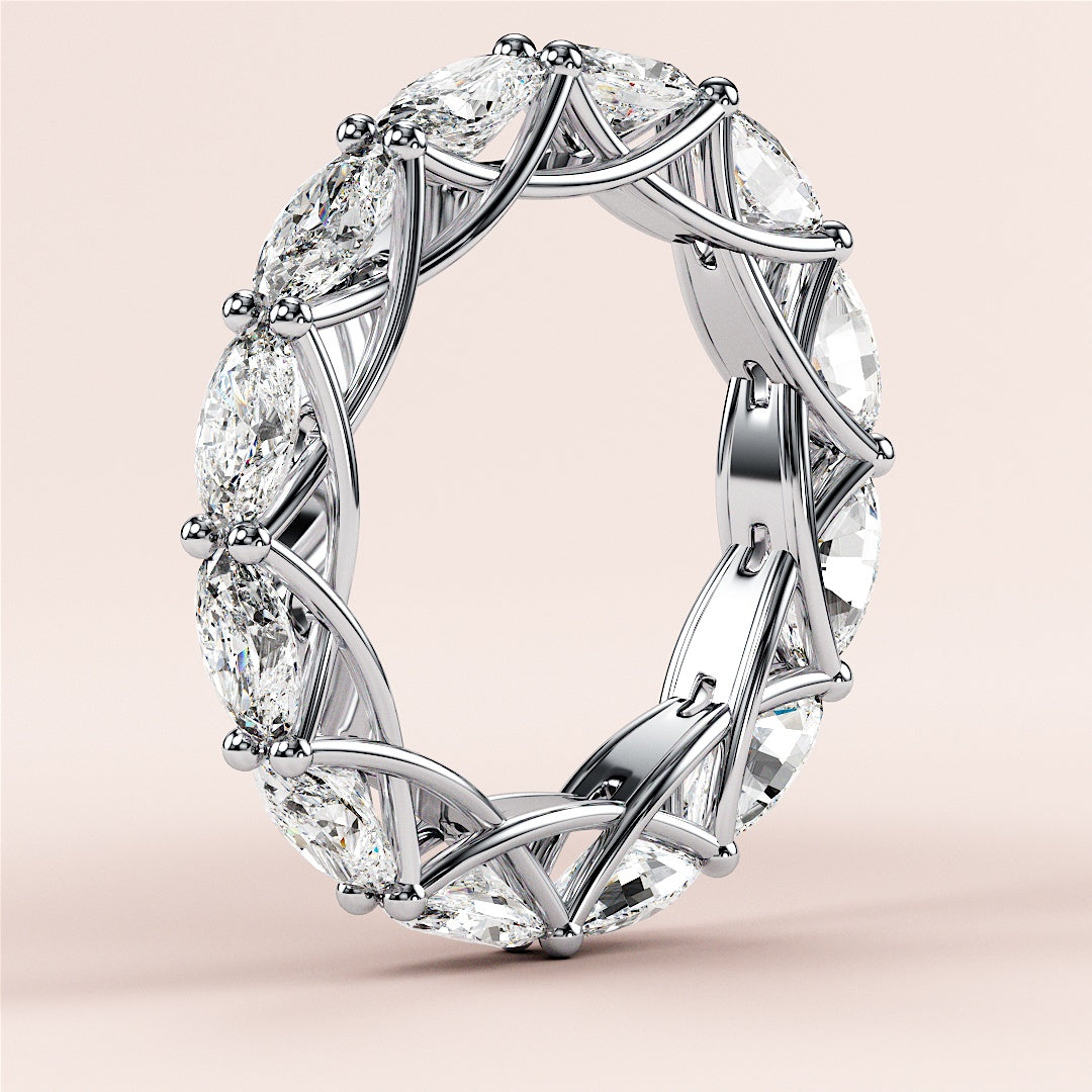 Luxurious 14K white gold eternity band with marquise-cut diamonds, showcasing impeccable craftsmanship and elegance for weddings. 