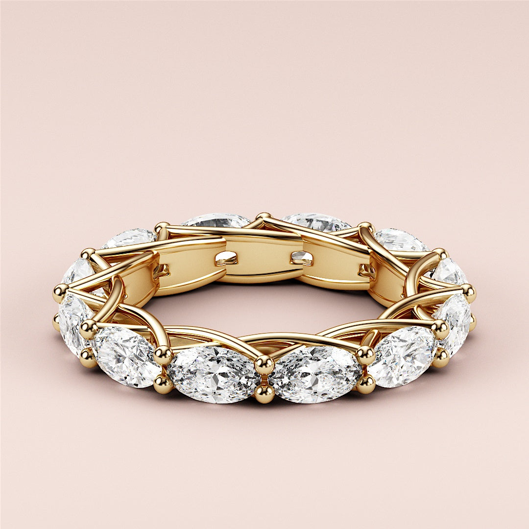 Elegant 14K or 18K yellow gold eternity wedding band featuring marquise-cut diamonds in a trellis design, showcasing exquisite craftsmanship. 