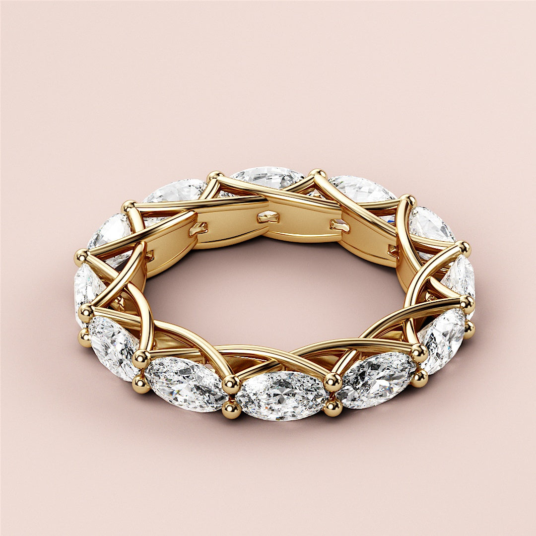 Elegant yellow gold wedding band featuring marquise-cut diamonds, available in 14K, 18K, and platinum settings. 