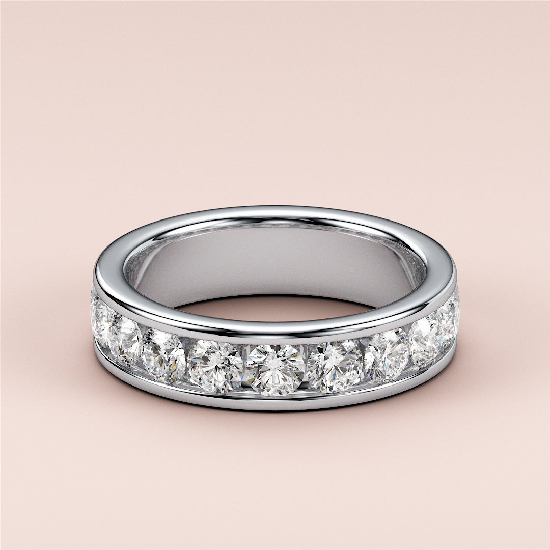 Elegant 14K white gold eternity band featuring round brilliant diamonds in channel setting. 