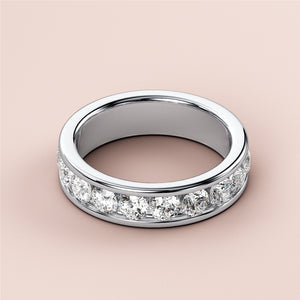 Women's wedding band featuring round-cut diamonds in channel setting, crafted in 14K or 18K gold or platinum.  Elegant eternity design. 