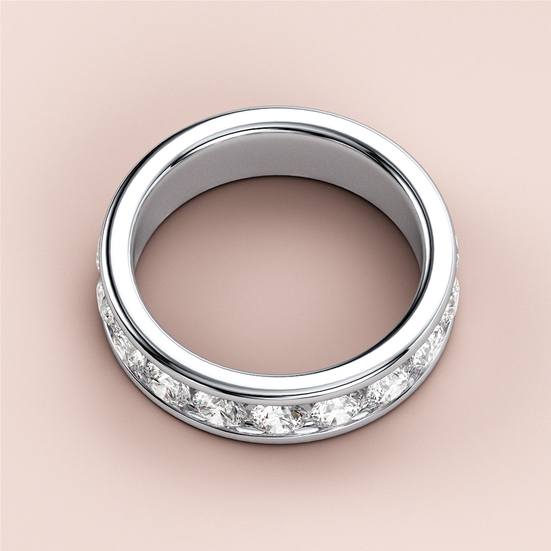 Elegant white gold wedding band featuring a diamond channel set design, available in 14K, 18K, or platinum, showcasing brilliant round diamonds. |
 #14KRecycledWhiteGold
 #18KRecycledWhiteGold
 
 
 
 
 #Platinum