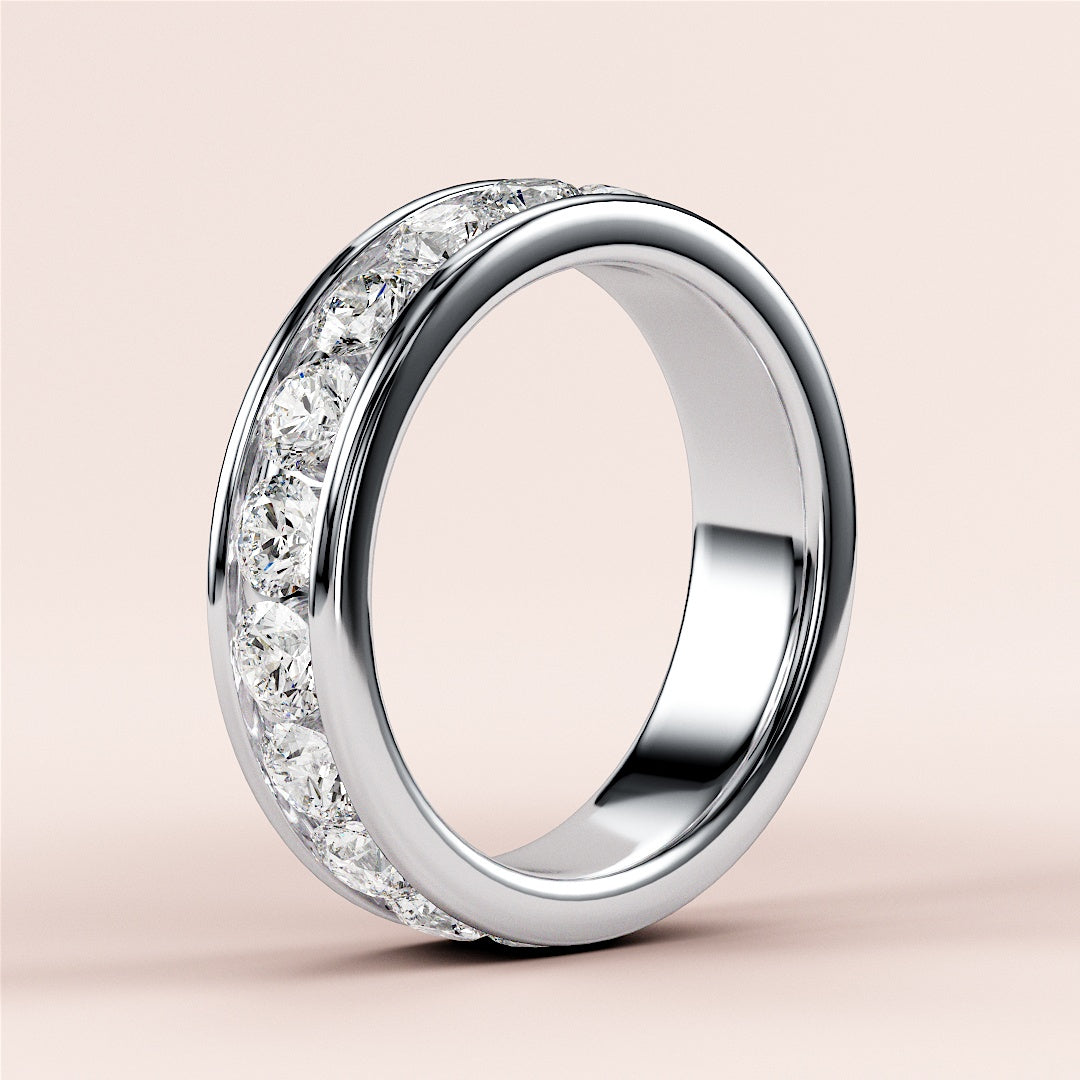 Elegant platinum or 14K/18K diamond eternity wedding band featuring round-cut diamonds in a channel setting, ideal for any occasion. |
 #14KRecycledWhiteGold
 #18KRecycledWhiteGold
 
 
 
 
 #Platinum