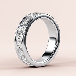 Elegant platinum or 14K/18K diamond eternity wedding band featuring round-cut diamonds in a channel setting, ideal for any occasion. 