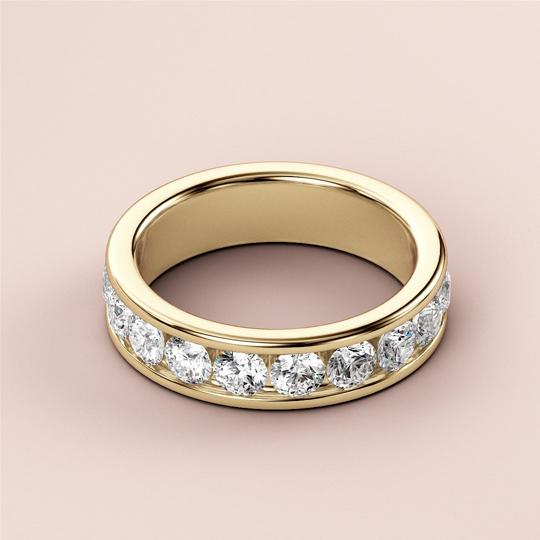 Elegant 14K Yellow Gold wedding band featuring brilliant round-cut diamonds in a channel setting, perfect for eternity. |
 
 
 #14KRecycledYellowGold
 #18KRecycledYellowGold