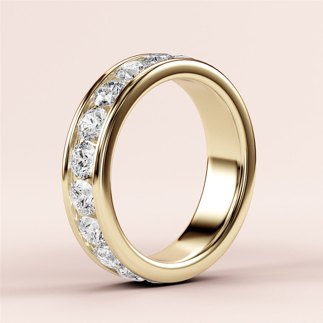 Elegant 14K gold channel-set diamond eternity band featuring brilliant-cut round diamonds, perfect as a wedding or anniversary ring. |
 
 
 #14KRecycledYellowGold
 #18KRecycledYellowGold