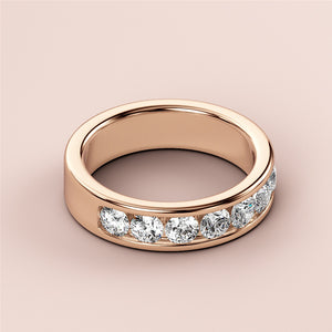 Luxurious 14K rose gold wedding band featuring round brilliant-cut diamonds in a channel design for timeless elegance. 