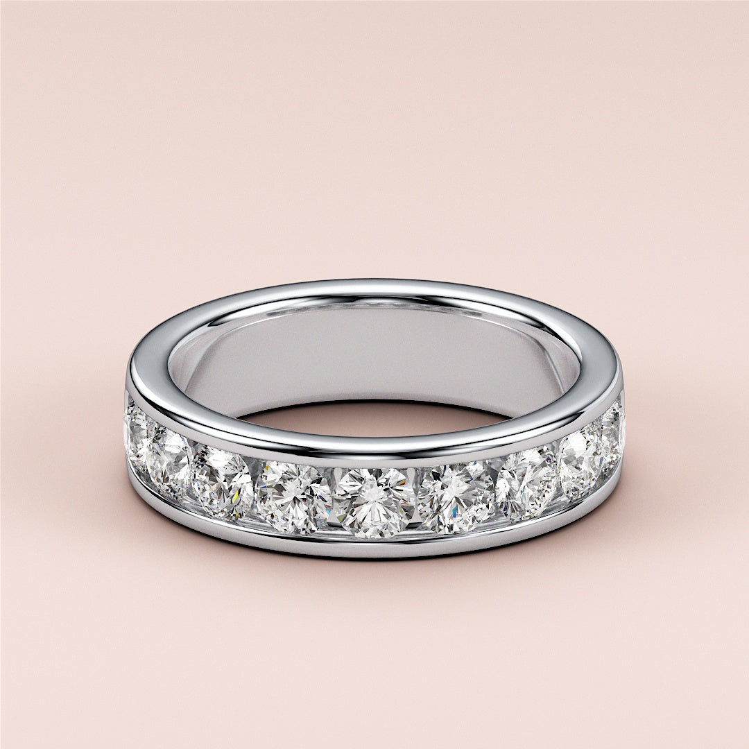 Luxurious 14K White Gold wedding band featuring a channel-set row of dazzling round diamonds for a contemporary, sophisticated look. 