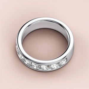Stunning white gold wedding band featuring round brilliant cut diamonds in a channel setting, available in 14K and 18K. 