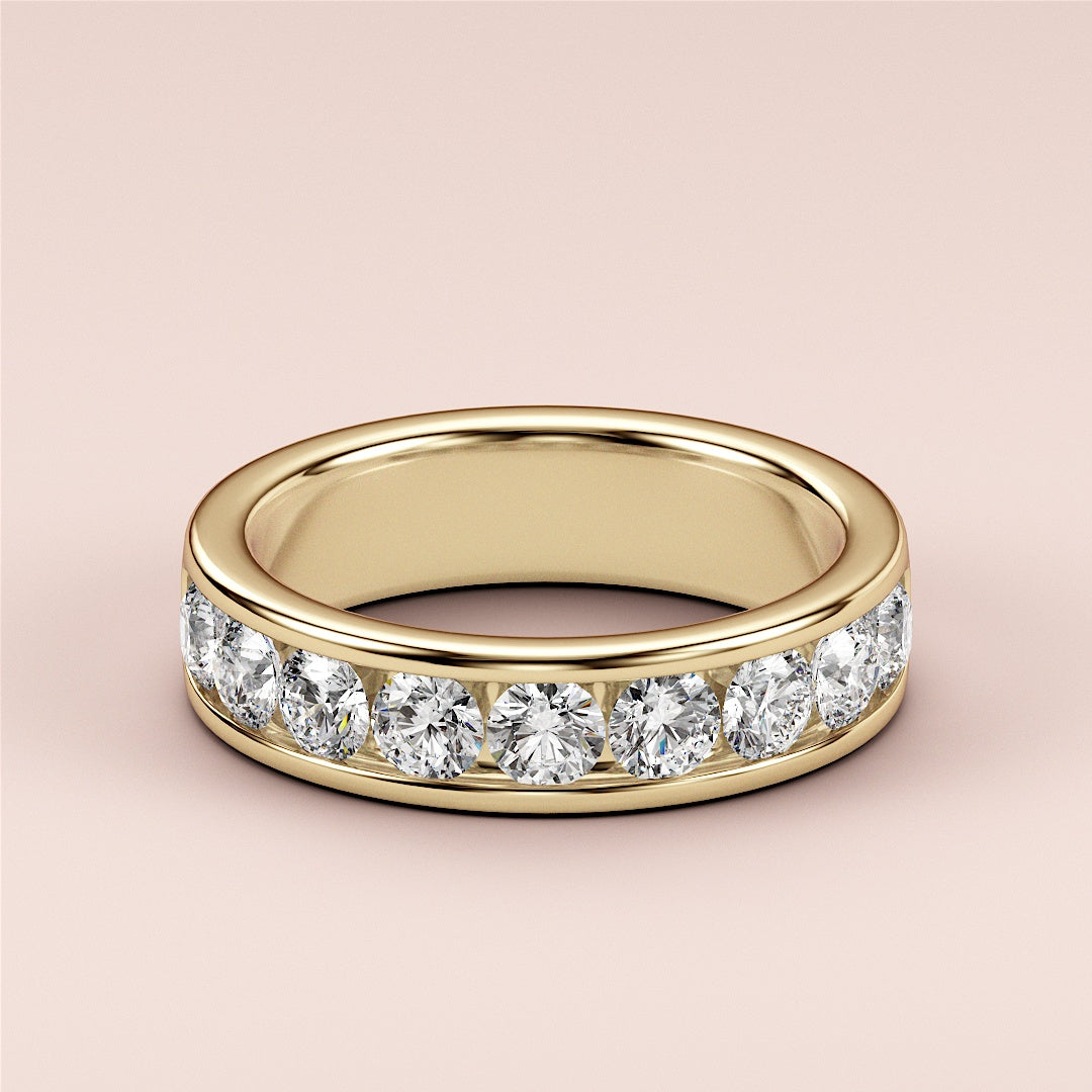 Elegant 14K Yellow Gold wedding band featuring a row of brilliant round-cut diamonds, perfect for timeless elegance and special occasions. 