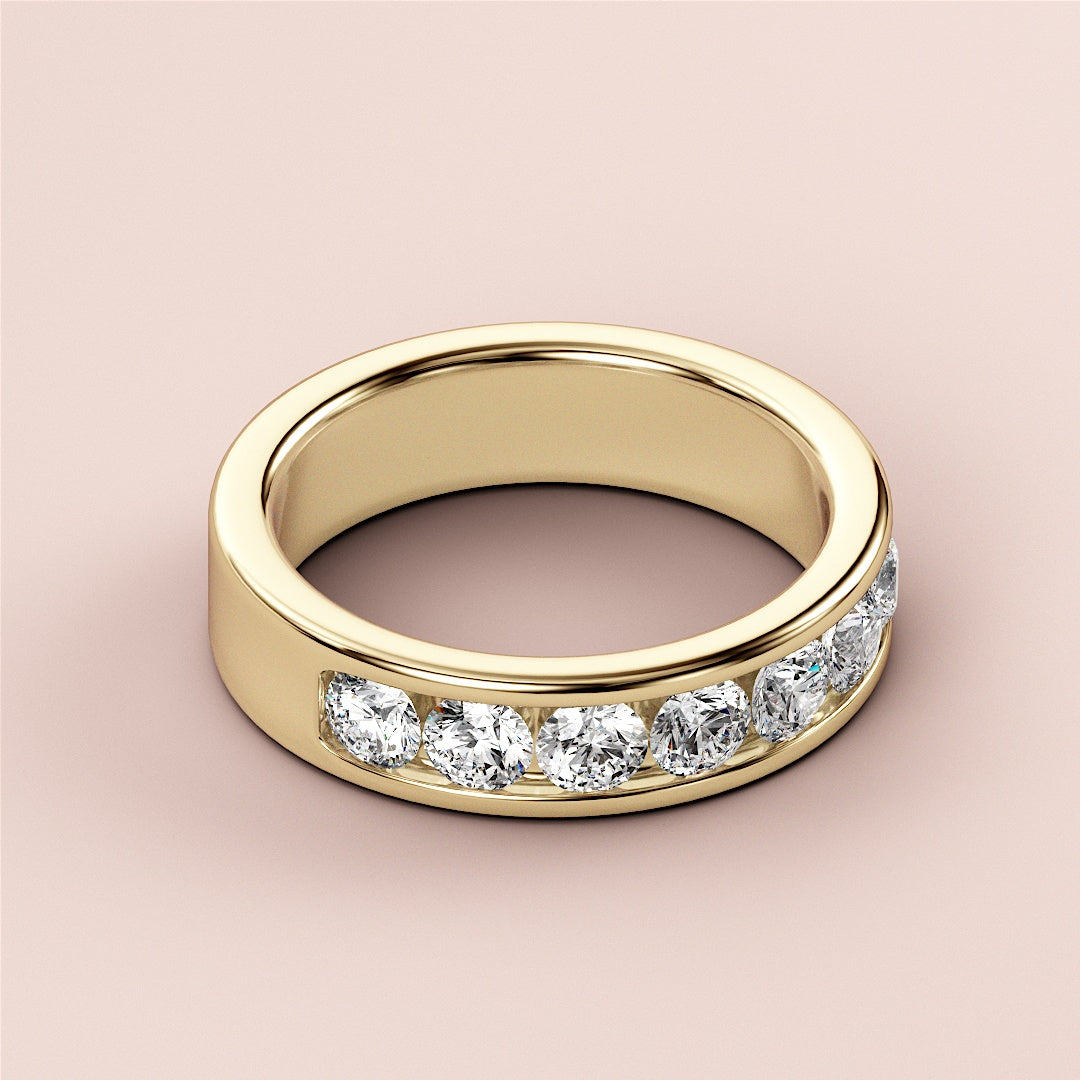 14K yellow gold wedding band featuring a row of sparkling round-cut diamonds, perfect for an eternity celebration. 