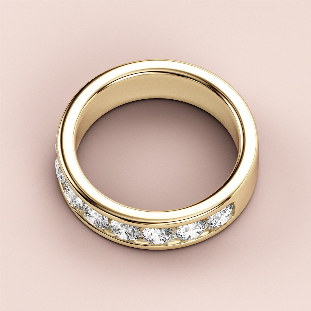 Elegant yellow gold wedding band with round-cut diamonds, available in 14K and 18K, embodying timeless beauty and sophistication. 
