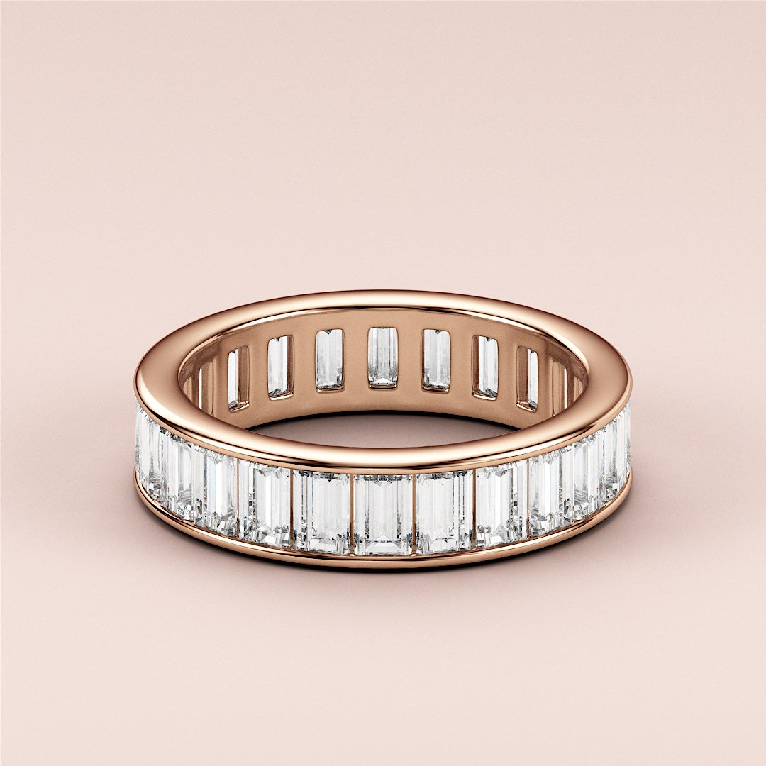 Elegant 14K Rose Gold wedding band featuring emerald channel-set baguette diamonds in a stunning eternity design. |
 
 
 
 
 #14KRecycledRoseGold
 #18KRecycledRoseGold