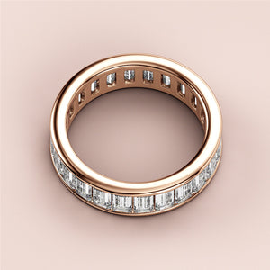 14K/18K rose gold baguette-cut diamond eternity wedding band, featuring a continuous line of shimmering diamonds for elegance. 