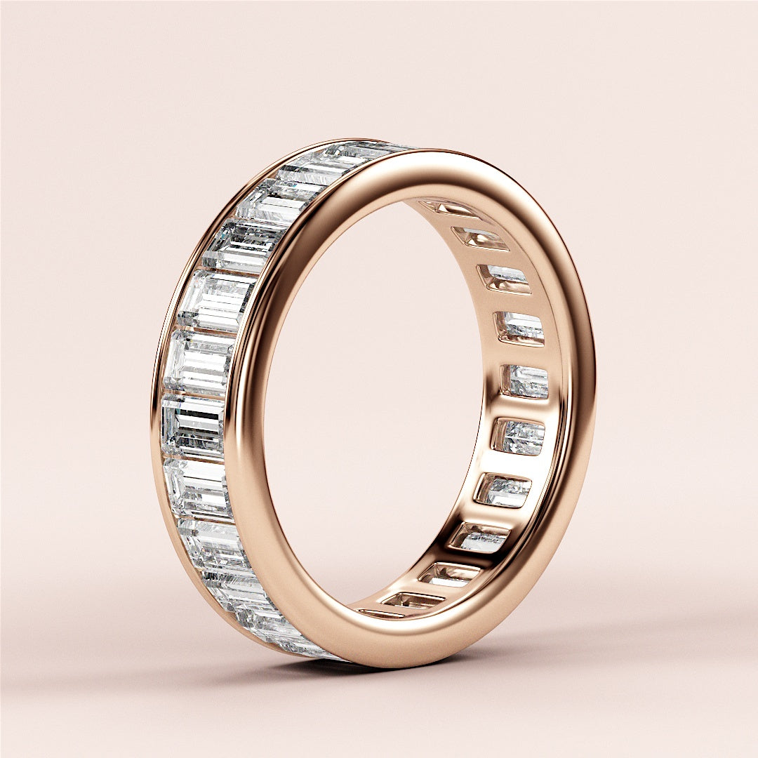Elegant 14K or 18K rose gold wedding band featuring baguette-cut diamonds in channel setting for ultimate eternity style. |
 
 
 
 
 #14KRecycledRoseGold
 #18KRecycledRoseGold